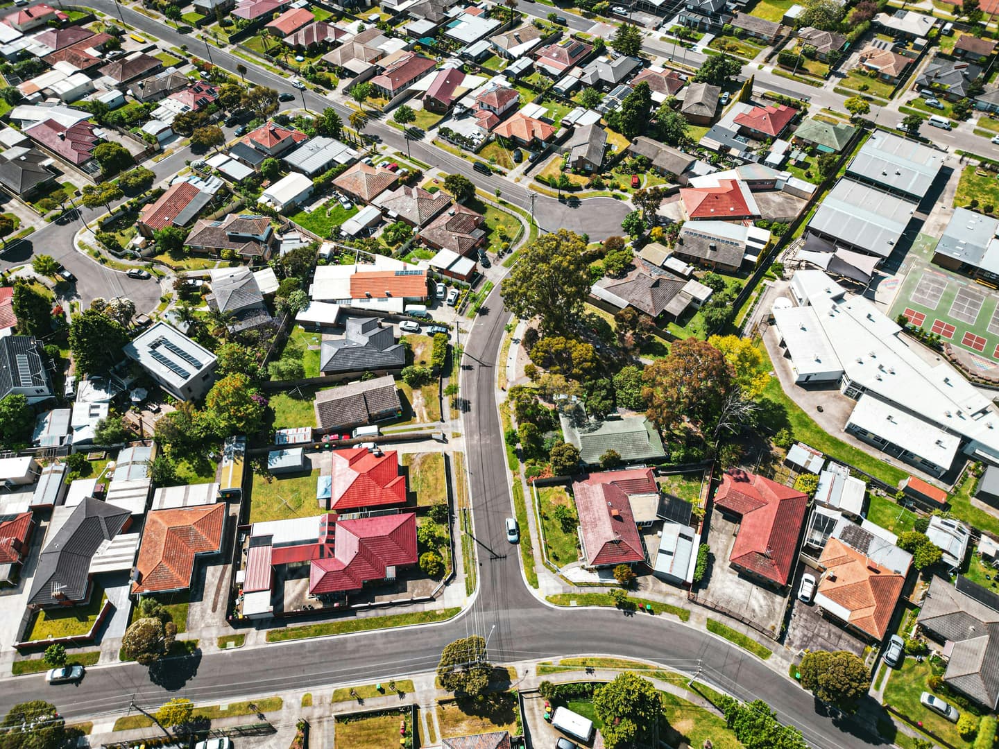 Aerial view of suburban streets and family homes